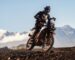 KTM adventure motorcycle with custom LED headlight by 3Dit in workshop garage setting