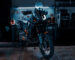 KTM adventure motorcycle with custom LED headlight by 3Dit in workshop garage setting