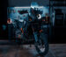 KTM adventure motorcycle with custom LED headlight by 3Dit in workshop garage setting