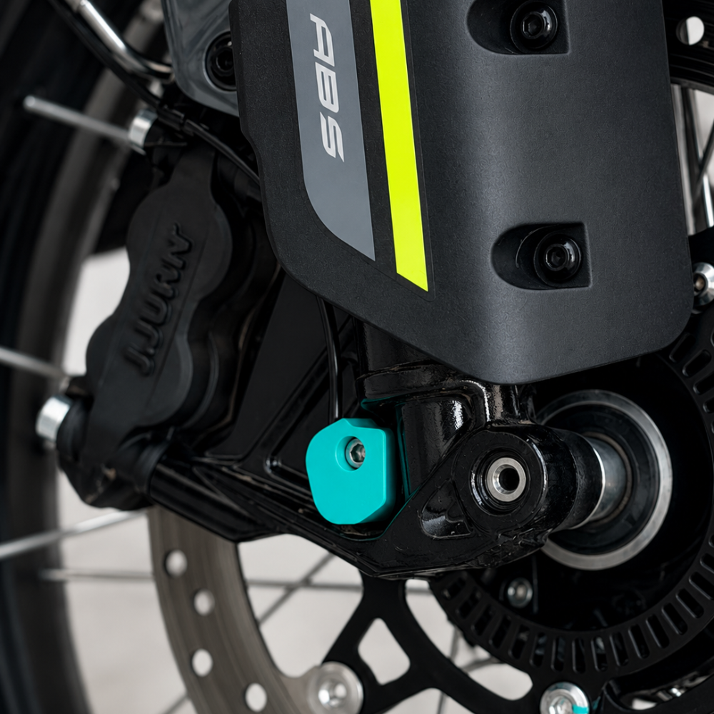 Close-up of the 3Dit CFMOTO 450MT rear ABS cover installed near the rear brake assembly and axle system.